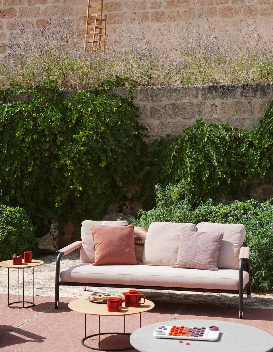 RODA Astra lounge chairs and sofa on a terrace, RODA garden furniture catalog photograph