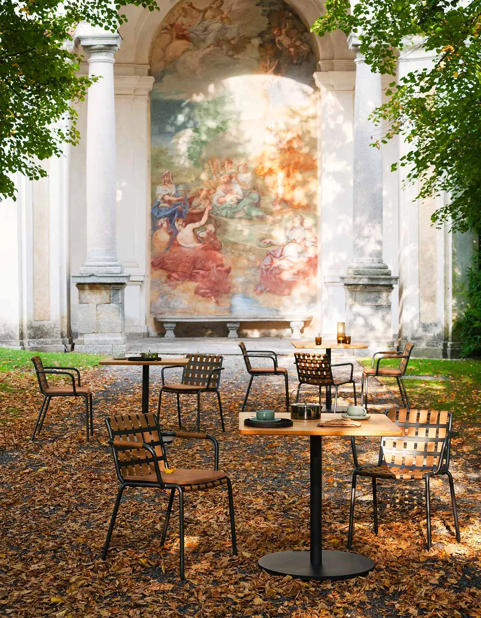 RODA Button bistro tables on a restaurant terrace, RODA furniture catalog photograph