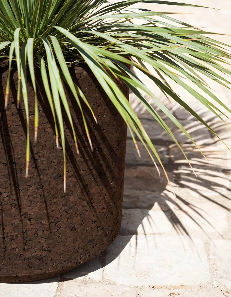 RODA Cortica outdoor furniture on a terrace, catalog photograph 2