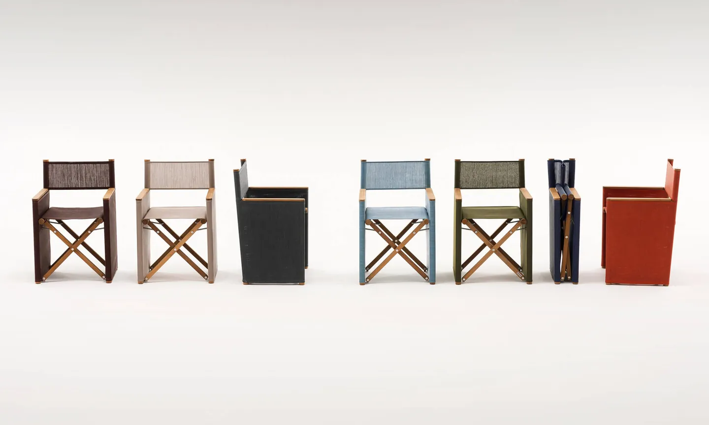 RODA Orson teak director chairs and sunlounger on a garden terrace, Italian outdoor furniture catalog photograph