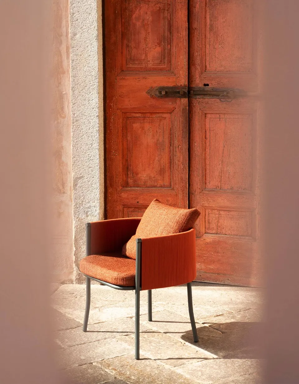 RODA Saddle armchairs at an outdoor dining table, RODA outdoor furniture catalog photograph