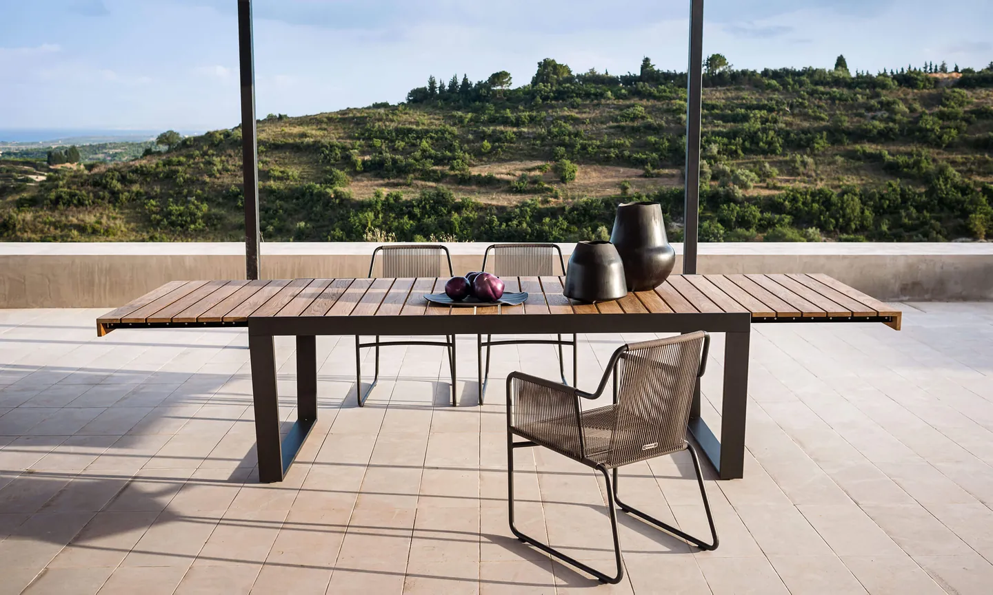 RODA Spinnaker teak table set for outdoor dining, RODA furniture catalog photograph