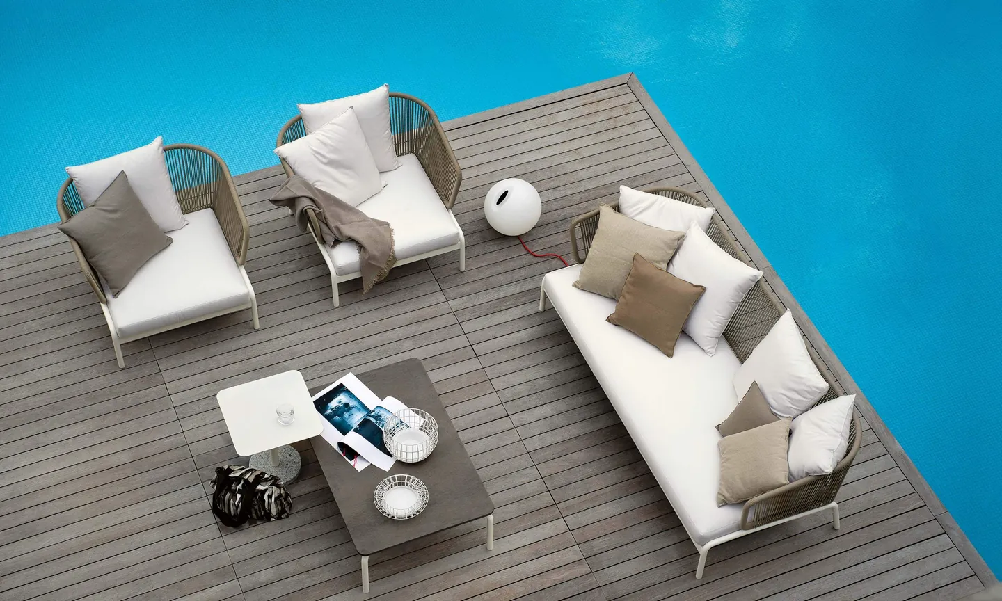 RODA Spool sofas and coffee table on a terrace, RODA patio furniture catalog photograph