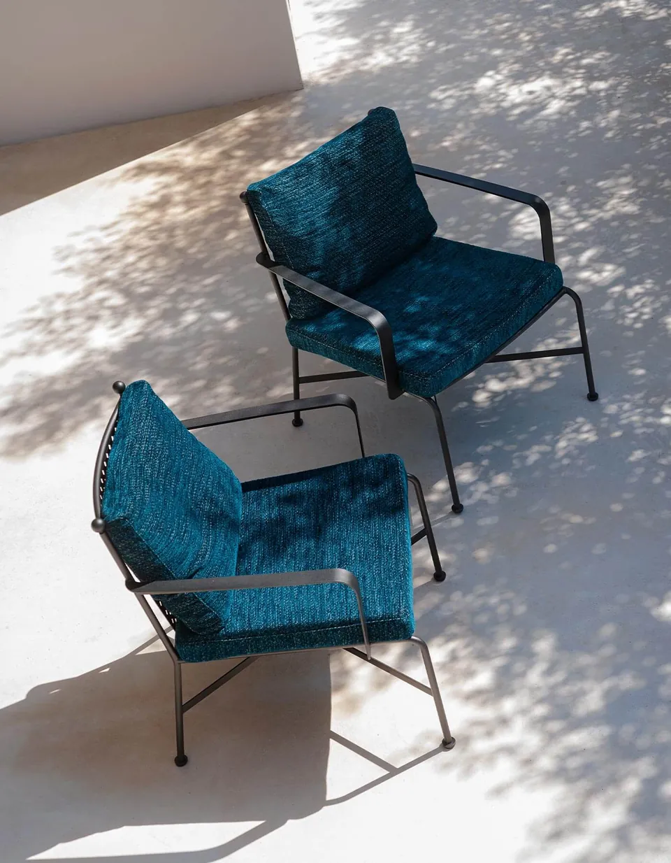 RODA Stresa sofas and dining table on a garden terrace, RODA outdoor furniture catalog photograph