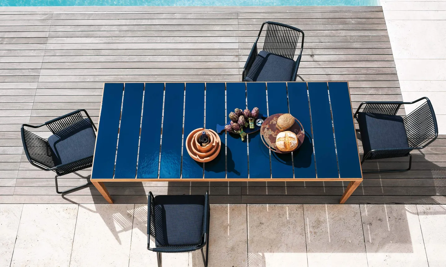 RODA Teka teak sofas and coffee table on a terrace, RODA garden furniture catalog photograph
