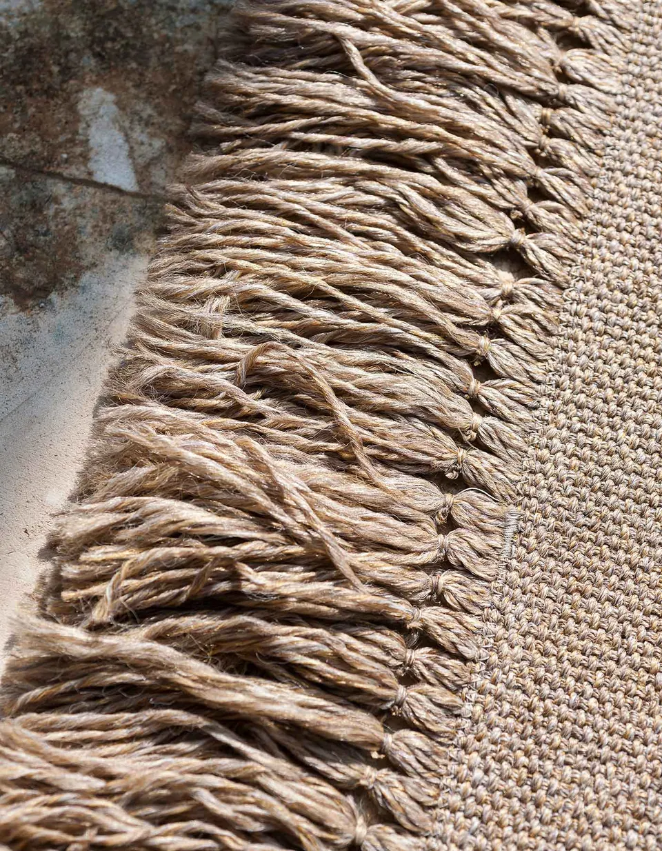 RODA Triptyque rug under an outdoor sofa on a terrace, RODA garden furniture catalog photograph